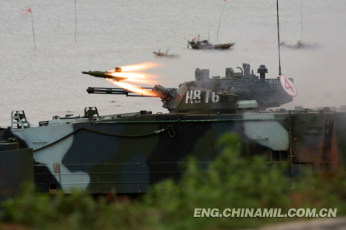 A brigade of the Marine Corps under the Navy of the Chinese Peoples Liberation Army (PLA), which was praised as l(f)and tiger, sea dragon and air eagle, carried out a series of amphibious armored training at the end of the year 2012 so as to solve the bottleneck problems in assessment. The photo shows the splendid moment of training. (China Military Online/Li Tang)