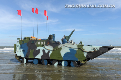 A brigade of the Marine Corps under the Navy of the Chinese Peoples Liberation Army (PLA), which was praised as l(f)and tiger, sea dragon and air eagle, carried out a series of amphibious armored training at the end of the year 2012 so as to solve the bottleneck problems in assessment. The photo shows the splendid moment of training. (China Military Online/Li Tang)