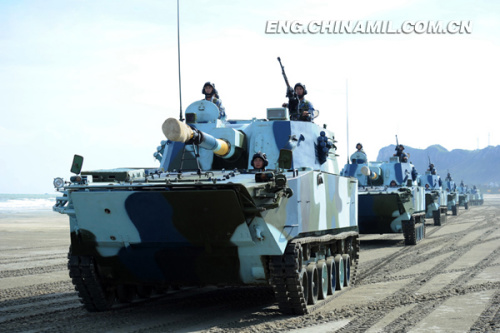 A brigade of the Marine Corps under the Navy of the Chinese Peoples Liberation Army (PLA), which was praised as l(f)and tiger, sea dragon and air eagle, carried out a series of amphibious armored training at the end of the year 2012 so as to solve the bottleneck problems in assessment. The photo shows the splendid moment of training. (China Military Online/Li Tang)