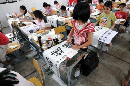 Kids learn traditional Chinese calligraphy