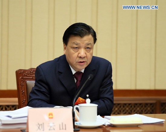 Liu Yunshan, executive chairperson of the presidium of the first session of the 12th National People's Congress (NPC), speaks at the third meeting of the presidium at the Great Hall of the People in Beijing, capital of China, March 12, 2013. Entrusted by the Central Committee of the Communist Party of China (CPC), Liu Yunshan, also a member of the Standing Committee of the Political Bureau of the CPC Central Committee, made explanations to the presidium on the candidates for the state leadership positions. (Xinhua/Lan Hongguang)