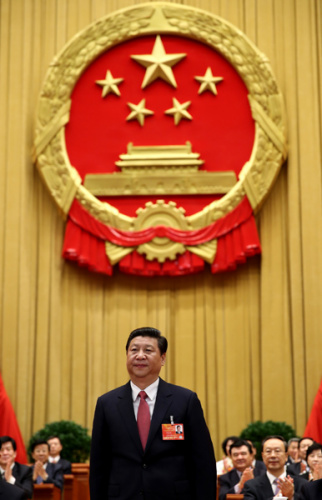Xi Jinping greets deputies at the fourth plenary meeting of the first session of the 12th National People's Congress (NPC) in Beijing, capital of China, March 14, 2013. Xi was elected president of the People's Republic of China (PRC) and chairman of the C