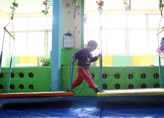 With increasing concern toward the autism community, hundreds of facilities and institutes for autistic children, like the Beijing's Haidian Modern Kindergarten, have sprung up all over the country. Photos by Zou Hong/China Daily