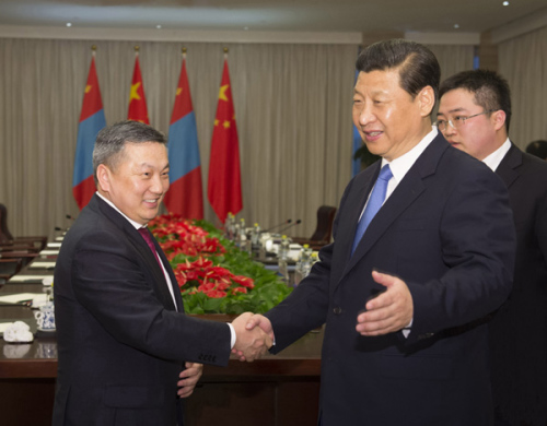 Chinese President Xi Jinping (R) shakes hands with Chairman of State Great Hural of Mongolia Zandaakhuu Enkhbold during their meeting on the sidelines of Boao Forum for Asia (BFA) Annual Conference 2013 in Boao, south China's Hainan Province, April 7, 2013. (Xinhua/Li Xueren)