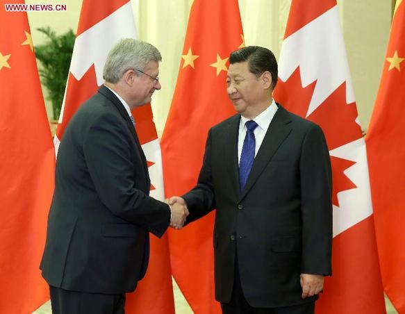 Chinese President Xi Jinping (R) meets with Canadian Prime Minister Stephen Harper at the Great Hall of the People in Beijing, capital of China, Nov. 9, 2014. (Xinhua/Pang Xinglei)