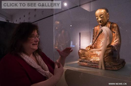 A Chinese Buddha statue with the mummified body of a Buddhist monk inside is on display at the Hungarian Natural History Museum in Budapest, Hungary on March 3, 2015. (Photo/Xinhua)