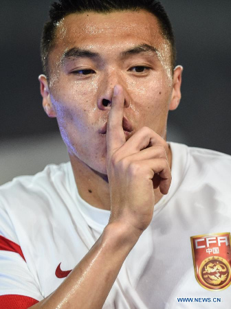 China's Yu Dabao celebrates after scoring during a soccer friendly match against Tunisia in Nanjing, capital of east China's Jiangsu Province, March 31, 2015. The match ended in a 1-1 draw. (Xinhua/Yang Lei) China's Yu Dabao celebrates after scoring during a soccer friendly match against Tunisia in Nanjing, capital of east China's Jiangsu Province, March 31, 2015. The match ended in a 1-1 draw. (Xinhua/Yang Lei)