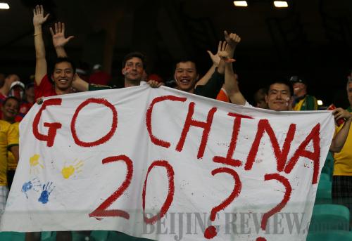 EXPECTATION: Chinese football fans hold a banner to express their hopes for the future of the sport in the country during a quarter-final game at the World Cup on July 5, 2014, in Brazil (XINHUA) EXPECTATION: Chinese football fans hold a banner to express their hopes for the future of the sport in the country during a quarter-final game at the World Cup on July 5, 2014, in Brazil (XINHUA)
