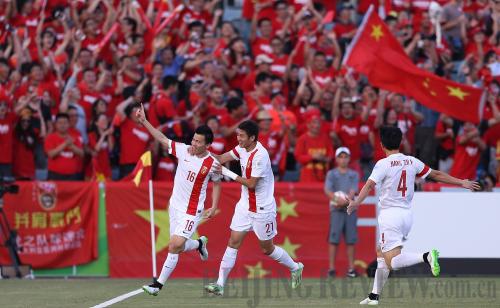 JOYFUL MOMENT: Chinese football player Sun Ke (left) waves to fans after scoring a goal during a game against the North Korean Football Team at the Asian Cup in Canberra, Australia, on January 18 (XINHUA) JOYFUL MOMENT: Chinese football player Sun Ke (left) waves to fans after scoring a goal during a game against the North Korean Football Team at the Asian Cup in Canberra, Australia, on January 18 (XINHUA)