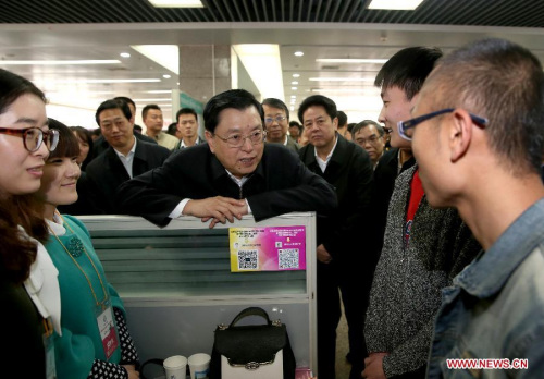 Zhang Dejiang (C), chairman of the Standing Committee of China's National People's Congress, communicates with students applying for jobs in Zhengzhou, capital of central China's Henan Province, April 13, 2015. Zhang Dejiang checked enforcement of the Vocational Education Law in central China's Henan Province from April 12 to 15. (Xinhua/Ma Zhancheng) Zhang Dejiang (C), chairman of the Standing Committee of China's National People's Congress, communicates with students applying for jobs in Zhengzhou, capital of central China's Henan Province, April 13, 2015. Zhang Dejiang checked enforcement of the Vocational Education Law in central China's Henan Province from April 12 to 15. (Xinhua/Ma Zhancheng)