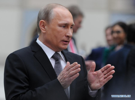 Russian President Vladimir Putin speaks with journalists after the live broadcast of the annual call-in show Conversation With Vladimir Putin in Moscow, Russia, April 16, 2015. (Xinhua/Jia Yuchen)