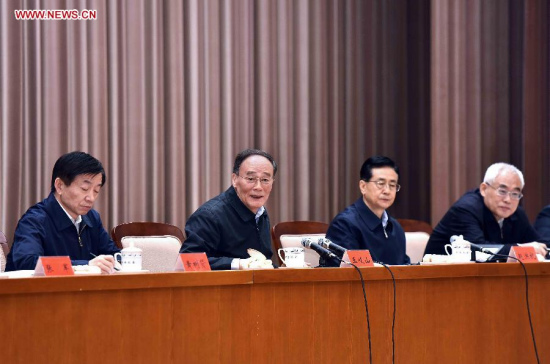 Wang Qishan (2nd L), a member of the Standing Committee of the Political Bureau of the Communist Party of China (CPC) Central Committee and secretary of the CPC Central Commission for Discipline Inspection (CCDI), addresses the launching of training classes on the establishment of CCDI branches, in Beijing, capital of China, April 19, 2015. Wang also gave a speech on studying President Xi Jinping's speeches at the launching on Sunday. (Xinhua/Li Tao) Wang Qishan (2nd L), a member of the Standing Committee of the Political Bureau of the Communist Party of China (CPC) Central Committee and secretary of the CPC Central Commission for Discipline Inspection (CCDI), addresses the launching of training classes on the establishment of CCDI branches, in Beijing, capital of China, April 19, 2015. Wang also gave a speech on studying President Xi Jinping's speeches at the launching on Sunday. (Xinhua/Li Tao)