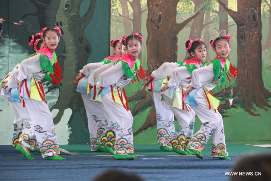 Children perform at the Lusaka International Community School in Lusaka, capital of Zambia, April 20, 2015. The Nanjing Little Red Flower Art Troupe of China conducted a two-hour performance on Monday at the Lusaka International Community School in Lusaka. (Xinhua/Peng Lijun) Children perform at the Lusaka International Community School in Lusaka, capital of Zambia, April 20, 2015. The Nanjing Little Red Flower Art Troupe of China conducted a two-hour performance on Monday at the Lusaka International Community School in Lusaka. (Xinhua/Peng Lijun)