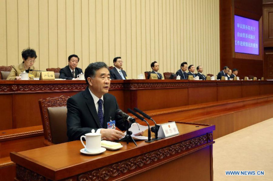Chinese Vice Premier Wang Yang (front) delivers a report on pilot free trade zone during the second plenary session of the 14th meeting of the 12th National People's Congress (NPC) Standing Committee in Beijing, China, April 22, 2015. Zhang Dejiang, chairman of the NPC Standing Committee, attended the meeting. (Xinhua/Liu Weibing) Chinese Vice Premier Wang Yang (front) delivers a report on pilot free trade zone during the second plenary session of the 14th meeting of the 12th National People's Congress (NPC) Standing Committee in Beijing, China, April 22, 2015. Zhang Dejiang, chairman of the NPC Standing Committee, attended the meeting. (Xinhua/Liu Weibing)