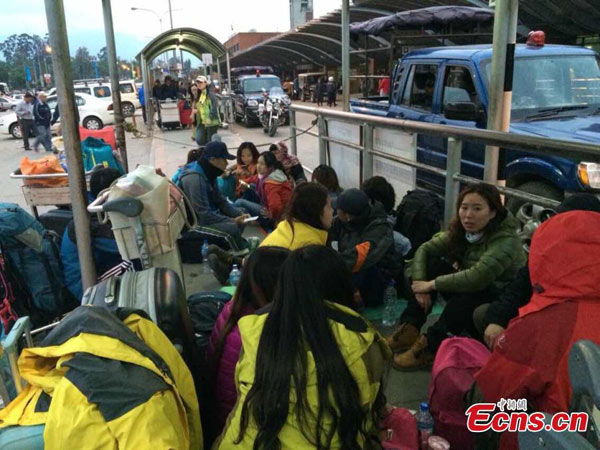 Chinese tourists are seen outside the Kathmandu airport after an 8.1-magnitude earthquake hits Nepal on Saturday, April 25, 2015. The airport was shut on Saturday following the strong earthquake. (Photo/China News Service) Chinese tourists are seen outside the Kathmandu airport after an 8.1-magnitude earthquake hits Nepal on Saturday, April 25, 2015. The airport was shut on Saturday following the strong earthquake. (Photo/China News Service)