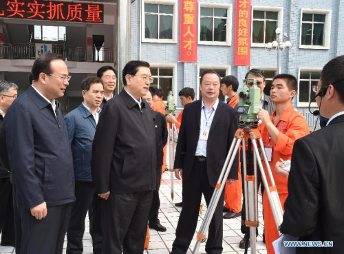 Zhang Dejiang (front, 2nd L), chairman of the Standing Committee of China's National People's Congress (NPC) and a member of the Standing Committee of the Political Bureau of the Communist Party of China (CPC) Central Committee, visits Chongqing industrial and commercial school in Chongqing, southwest China, April 26, 2015. Zhang Dejiang, leading an inspection team, reviewed the implementation of the Vocational Education Law in Chongqing from April 25 to 27. (Xinhua/Gao Jie) Zhang Dejiang (front, 2nd L), chairman of the Standing Committee of China's National People's Congress (NPC) and a member of the Standing Committee of the Political Bureau of the Communist Party of China (CPC) Central Committee, visits Chongqing industrial and commercial school in Chongqing, southwest China, April 26, 2015. Zhang Dejiang, leading an inspection team, reviewed the implementation of the Vocational Education Law in Chongqing from April 25 to 27. (Xinhua/Gao Jie)