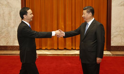 Xi Jinping (right), general secretary of the Central Committee of the Communist Party of China, meets with Kuomintang Chairman Eric Chu Li-luan in Beijing on Monday. (Photo/China News Service) Xi Jinping (right), general secretary of the Central Committee of the Communist Party of China, meets with Kuomintang Chairman Eric Chu Li-luan in Beijing on Monday. (Photo/China News Service)