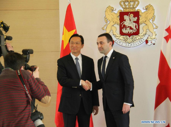 Georgian Prime Minister Irakli Garibashvili (1st R) shakes hands with visiting Chinese Agriculture Minister Han Changfu during their meeting in Tbilist, Georgia, May 11, 2015. (Xinhua/Li Ming) Georgian Prime Minister Irakli Garibashvili (1st R) shakes hands with visiting Chinese Agriculture Minister Han Changfu during their meeting in Tbilist, Georgia, May 11, 2015. (Xinhua/Li Ming)