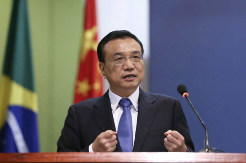 Premier Li Keqiang addresses a business summit between China and Brazil in Brasilia, capital of the Latin American country on May 19.[Photo/english.gov.cn]