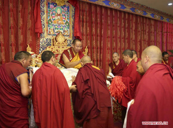 The 11th Panchen Lama Bainqen Erdini Qoigyijabu conducts a ritual to bless Tibetan Buddhism scholars, all monks graduating from the High-level Tibetan Buddhism College of China, in Beijing, captial of China, May 20, 2015. (Photo: Xinhua/Ma Zhancheng) The 11th Panchen Lama Bainqen Erdini Qoigyijabu conducts a ritual to bless Tibetan Buddhism scholars, all monks graduating from the High-level Tibetan Buddhism College of China, in Beijing, captial of China, May 20, 2015. (Photo: Xinhua/Ma Zhancheng)
