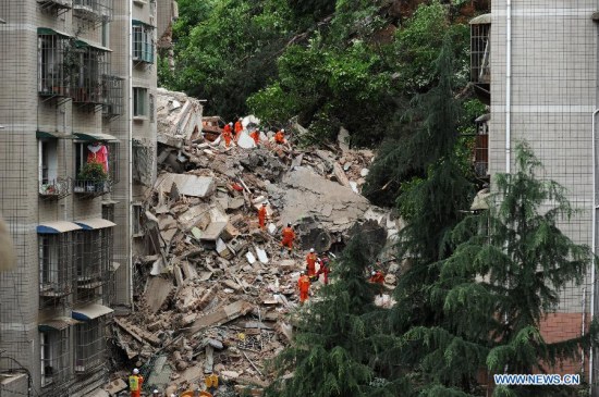 Rescuers search for survivors at a residential building collapse site in Guiyang, capital of southwest China's Guizhou Province, May 20, 2015. A nine-storey building collapsed in Guiyang on Wednesday. Rescuers have confirmed that there are people trapped inside, but casualties are not known yet. (Xinhua/Tao Liang) Rescuers search for survivors at a residential building collapse site in Guiyang, capital of southwest China's Guizhou Province, May 20, 2015. A nine-storey building collapsed in Guiyang on Wednesday. Rescuers have confirmed that there are people trapped inside, but casualties are not known yet. (Xinhua/Tao Liang)