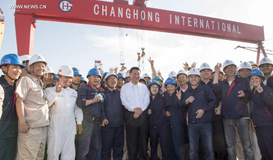Chinese President Xi Jinping poses for photos with workers of Changhong international ship building and repairing co. ltd. in east China's Zhejiang Province, May 25, 2015. Xi had an inspection tour in Zhejiang Province from May 25 to 27. (Xinhua/Xie Huanchi) Chinese President Xi Jinping poses for photos with workers of Changhong international ship building and repairing co. ltd. in east China's Zhejiang Province, May 25, 2015. Xi had an inspection tour in Zhejiang Province from May 25 to 27. (Xinhua/Xie Huanchi)