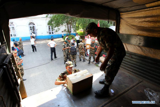 Nepal Army personnel load relief materials to a truck after a handover ceremony of China-aided medical supplies to Nepal in Kathmandu, Nepal, May 27, 2015. Chinese medical aid, including medical equipment, laboratory materials and other medical supplies, is worth 40 million Nepalese rupees (about 390,000 U.S. dollars). (Xinhua/Sunil Sharma) Nepal Army personnel load relief materials to a truck after a handover ceremony of China-aided medical supplies to Nepal in Kathmandu, Nepal, May 27, 2015. Chinese medical aid, including medical equipment, laboratory materials and other medical supplies, is worth 40 million Nepalese rupees (about 390,000 U.S. dollars). (Xinhua/Sunil Sharma)