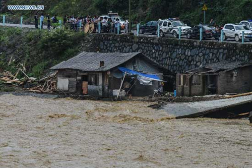 house is seen stranded in flood in Leishan County, southwest China's Guizhou Province, May 27, 2015. Leishan has lost access to power and water supplies after torrential rain battered the area from Tuesday night to Wednesday, and repairs are still under way. (Photo: Xinhua/Liu Xu) house is seen stranded in flood in Leishan County, southwest China's Guizhou Province, May 27, 2015. Leishan has lost access to power and water supplies after torrential rain battered the area from Tuesday night to Wednesday, and repairs are still under way. (Photo: Xinhua/Liu Xu)