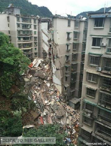 Rescuers search for survivors at a residential building collapse site in Guiyang, capital of southwest China's Guizhou Province, May 20, 2015. A nine-storey building collapsed in Guiyang on Wednesday. Rescuers have confirmed that there are people trapped inside, but casualties are not known yet. (Photo: Xinhua/Ou Dongqu)