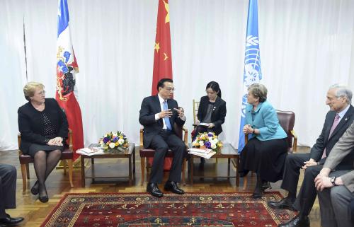 Accompanied by Chilean President Michelle Bachelet (left), Chinese Premier Li Keqiang meets with Alicia Barcena (right), Executive Secretary of the United Nations Economic Commission for Latin America and the Caribbean, in Santiago, Chile, on May 25 (XINHUA) Accompanied by Chilean President Michelle Bachelet (left), Chinese Premier Li Keqiang meets with Alicia Barcena (right), Executive Secretary of the United Nations Economic Commission for Latin America and the Caribbean, in Santiago, Chile, on May 25 (XINHUA)