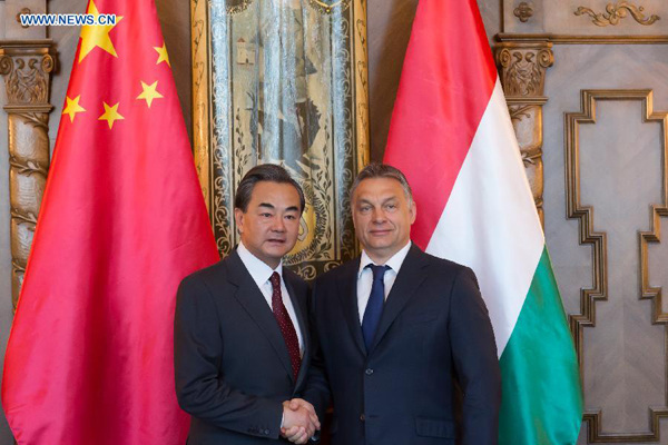 Hungarian Prime Minister Viktor Orban (R) and visiting Chinese Foreign Minister Wang Yi shake hands during a meeting in the Hungarian Parliament in Budapest, Hungary on June 6, 2015. (Xinhua/Attila Volgyi) Hungarian Prime Minister Viktor Orban (R) and visiting Chinese Foreign Minister Wang Yi shake hands during a meeting in the Hungarian Parliament in Budapest, Hungary on June 6, 2015. (Xinhua/Attila Volgyi)