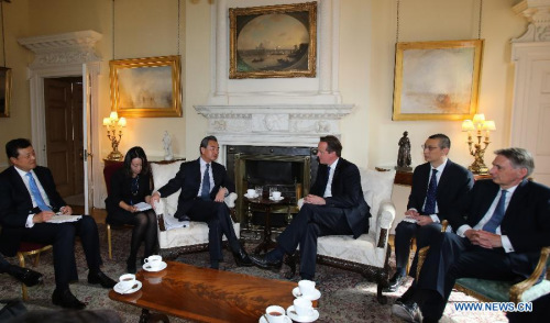 British Prime Minister David Cameron (3rd R) meets with visiting Chinese Foreign Minister Wang Yi (3rd L) in London, Great Britain, June 9, 2015. (Xinhua/Han Yan) British Prime Minister David Cameron (3rd R) meets with visiting Chinese Foreign Minister Wang Yi (3rd L) in London, Great Britain, June 9, 2015. (Xinhua/Han Yan)