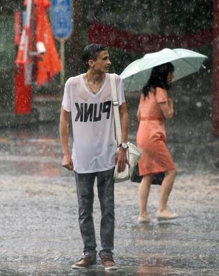 A man stands drenched through with rain in Beijing on Wednesday. (Photo: Wang Jing/China Daily) A man stands drenched through with rain in Beijing on Wednesday. (Photo: Wang Jing/China Daily)