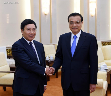 Chinese Premier Li Keqiang (R) meets with Vietnamese Deputy Prime Minister and Foreign Minister Pham Binh Minh in Beijing, capital of China, June 18, 2015. (Xinhua/Rao Aimin) Chinese Premier Li Keqiang (R) meets with Vietnamese Deputy Prime Minister and Foreign Minister Pham Binh Minh in Beijing, capital of China, June 18, 2015. (Xinhua/Rao Aimin)