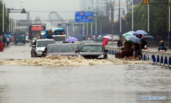 Motorcars try to pass a flooded road in Changzhou, east China's Jiangsu Province, June 17, 2015. Heavy rain on June 16 and 17 battered Jiangsu, southwest China's Chongqing Municipality, central China's Hubei Province, east China's Anhui Province and Shanghai Municipality. (Photo: Xinhua/Chen Wei) Motorcars try to pass a flooded road in Changzhou, east China's Jiangsu Province, June 17, 2015. Heavy rain on June 16 and 17 battered Jiangsu, southwest China's Chongqing Municipality, central China's Hubei Province, east China's Anhui Province and Shanghai Municipality. (Photo: Xinhua/Chen Wei)