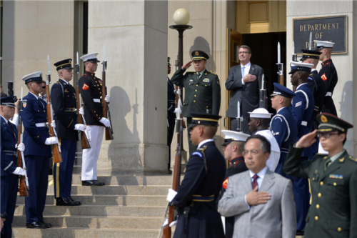 Chinese Central Military Commission Vice-Chairman Fan Changlong and US Secretary of Defense Ashton Carter salute as a US military band plays the national anthems of the two countries during a welcoming ceremony at the Pentagon on June 11. (Photo/Xinhua) Chinese Central Military Commission Vice-Chairman Fan Changlong and US Secretary of Defense Ashton Carter salute as a US military band plays the national anthems of the two countries during a welcoming ceremony at the Pentagon on June 11. (Photo/Xinhua)