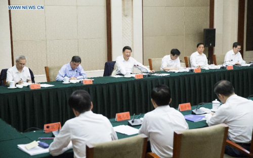 Chinese President Xi Jinping (rear, 3rd L) attends a Communist Party of China symposium on poverty relief and economic and social development in the 2016-2020 period in Guiyang, capital of southwest China's Guizhou Province, June 19, 2015. (Xinhua/Huang Jingwen) Chinese President Xi Jinping (rear, 3rd L) attends a Communist Party of China symposium on poverty relief and economic and social development in the 2016-2020 period in Guiyang, capital of southwest China's Guizhou Province, June 19, 2015. (Xinhua/Huang Jingwen)