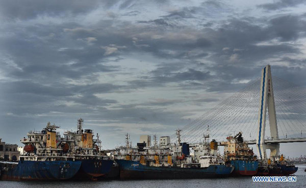 Ships berth at Xingang Harbor in Haikou, capital of south China's Hainan Province, June 21, 2015. Tropical storm Kujira strengthened into a typhoon in the South China Sea on Sunday, which is moving northward and likely to become the first typhoon to hit China this year. (Xinhua/Zhao Yingquan) Ships berth at Xingang Harbor in Haikou, capital of south China's Hainan Province, June 21, 2015. Tropical storm Kujira strengthened into a typhoon in the South China Sea on Sunday, which is moving northward and likely to become the first typhoon to hit China this year. (Xinhua/Zhao Yingquan)