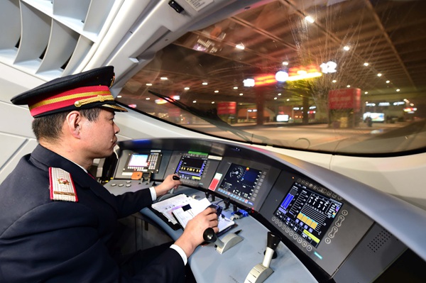 Xue Jun drives a bullet train heading to Beijing South Railway Station in February. (GUO XULEI/XINHUA NEWS AGENCY) Xue Jun drives a bullet train heading to Beijing South Railway Station in February. (GUO XULEI/XINHUA NEWS AGENCY)