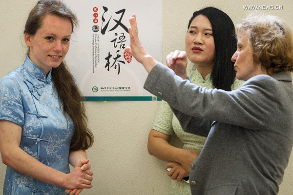 People talk during the 8th Chinese Bridge Chinese Proficiency Competition for Foreign Secondary School Students in Schnepfenthal Salzmann School, Walterhausen, central Germany, on June 21, 2015. (Xinhua/Zhang Fan) People talk during the 8th Chinese Bridge Chinese Proficiency Competition for Foreign Secondary School Students in Schnepfenthal Salzmann School, Walterhausen, central Germany, on June 21, 2015. (Xinhua/Zhang Fan)