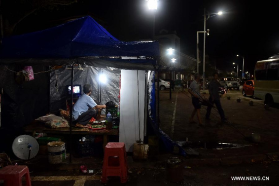 A stall by the street opens for business in Gangbei Harbor under Hele Town of Wanning City, south China's Hainan Province, June 22, 2015. Typhoon Kujira, the eighth typhoon of 2015, made landfall in the coastal city of Wanning at 6:50 p.m., packing winds of up to 90 kilometers per hour, said the Hainan Meteorological Service. (Photo: Xinhua/Guo Cheng) A stall by the street opens for business in Gangbei Harbor under Hele Town of Wanning City, south China's Hainan Province, June 22, 2015. Typhoon Kujira, the eighth typhoon of 2015, made landfall in the coastal city of Wanning at 6:50 p.m., packing winds of up to 90 kilometers per hour, said the Hainan Meteorological Service. (Photo: Xinhua/Guo Cheng)
