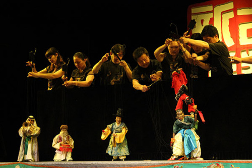 Members of the Quanzhou Marionette Troupe give a performance. The city of Quanzhou in Fujian province is home to traditional Chinese marionette. (Photo by Wang Kaihao/China Daily) Members of the Quanzhou Marionette Troupe give a performance. The city of Quanzhou in Fujian province is home to traditional Chinese marionette. (Photo by Wang Kaihao/China Daily)