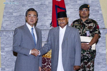 Chinese Foreign Minister Wang Yi (L) shakes hands with President of Nepal Ram Baran Yadav, in Kathmandu, Nepal, June 24, 2015. Wang Yi arrived at Kathmandu Wednesday. He will attend a conference of international donors in Kathmandu on June 24 and 25. (Xinhua/Pratap Thapa) Chinese Foreign Minister Wang Yi (L) shakes hands with President of Nepal Ram Baran Yadav, in Kathmandu, Nepal, June 24, 2015. Wang Yi arrived at Kathmandu Wednesday. He will attend a conference of international donors in Kathmandu on June 24 and 25. (Xinhua/Pratap Thapa)