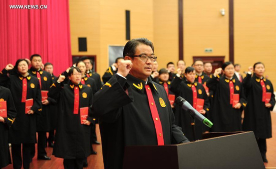 New judges of Guizhou Provincial Higher People's Court take oath in Guiyang, capital of southwest China's Guizhou province, Dec 4, 2014, on the occasion of China's first national Constitution Day. (Xinhua/Tao Liang) New judges of Guizhou Provincial Higher People's Court take oath in Guiyang, capital of southwest China's Guizhou province, Dec 4, 2014, on the occasion of China's first national Constitution Day. (Xinhua/Tao Liang)