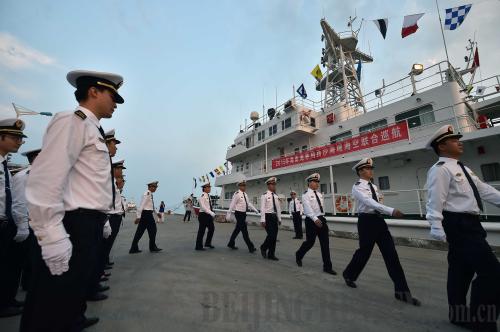 Officers with the Hainan Maritime Safety Administration board a ship in Sanya, Hainan Province, on April 21, for a patrol mission off the Xisha Islands in the South China Sea (XINHUA) Officers with the Hainan Maritime Safety Administration board a ship in Sanya, Hainan Province, on April 21, for a patrol mission off the Xisha Islands in the South China Sea (XINHUA)