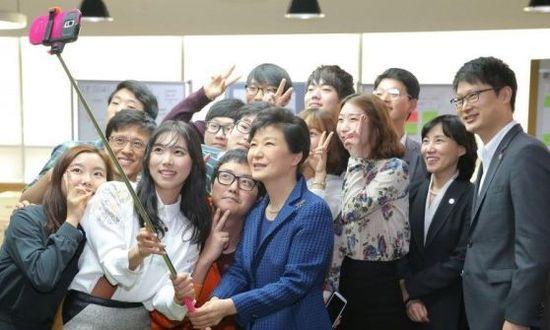 File photo shows Park Geun-hye, President of the Republic of Korea (ROK), taking a selfie with people.