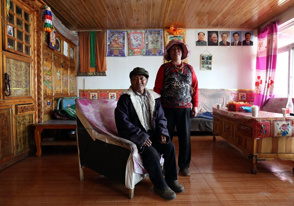 Pedor and his wife in their house in a relocation village built for former herdmen. (WANG JING/CHINA DAILY) Pedor and his wife in their house in a relocation village built for former herdmen. (WANG JING/CHINA DAILY)