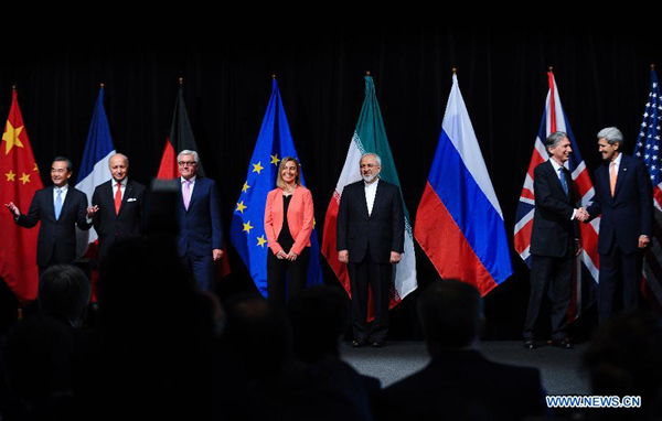 Chinese Foreign Minister Wang Yi, French Foreign Minister Laurent Fabius, German Foreign Minister Frank Walter Steinmeier, European Union (EU) foreign policy chief Federica Mogherini, Iranian Foreign Minister Mohammad Javad Zarif, British Foreign Secretary Philip Hammond, and U.S. Secretary of State John Kerry (from L to R) pose for a group picture in Vienna, Austria, on July 14, 2015. (Xinhua/Qian Yi) Chinese Foreign Minister Wang Yi, French Foreign Minister Laurent Fabius, German Foreign Minister Frank Walter Steinmeier, European Union (EU) foreign policy chief Federica Mogherini, Iranian Foreign Minister Mohammad Javad Zarif, British Foreign Secretary Philip Hammond, and U.S. Secretary of State John Kerry (from L to R) pose for a group picture in Vienna, Austria, on July 14, 2015. (Xinhua/Qian Yi)