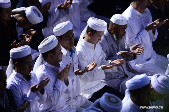 Muslims pray for celebrating the Eid al-Fitr which marks the end of Ramadan at Dongguan Mosque in Xining, capital of northwest China's Qinghai Province, July 17, 2015. (Xinhua/Zhang Hongxiang) Muslims pray for celebrating the Eid al-Fitr which marks the end of Ramadan at Dongguan Mosque in Xining, capital of northwest China's Qinghai Province, July 17, 2015. (Xinhua/Zhang Hongxiang)