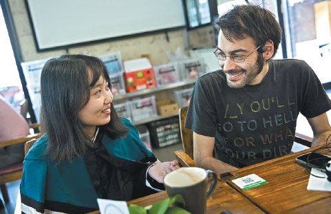 A language teacher from Italy (right) chats with a student who plans to study in Milan. (Photo by Chen Xiaodong/for China Daily) A language teacher from Italy (right) chats with a student who plans to study in Milan. (Photo by Chen Xiaodong/for China Daily)